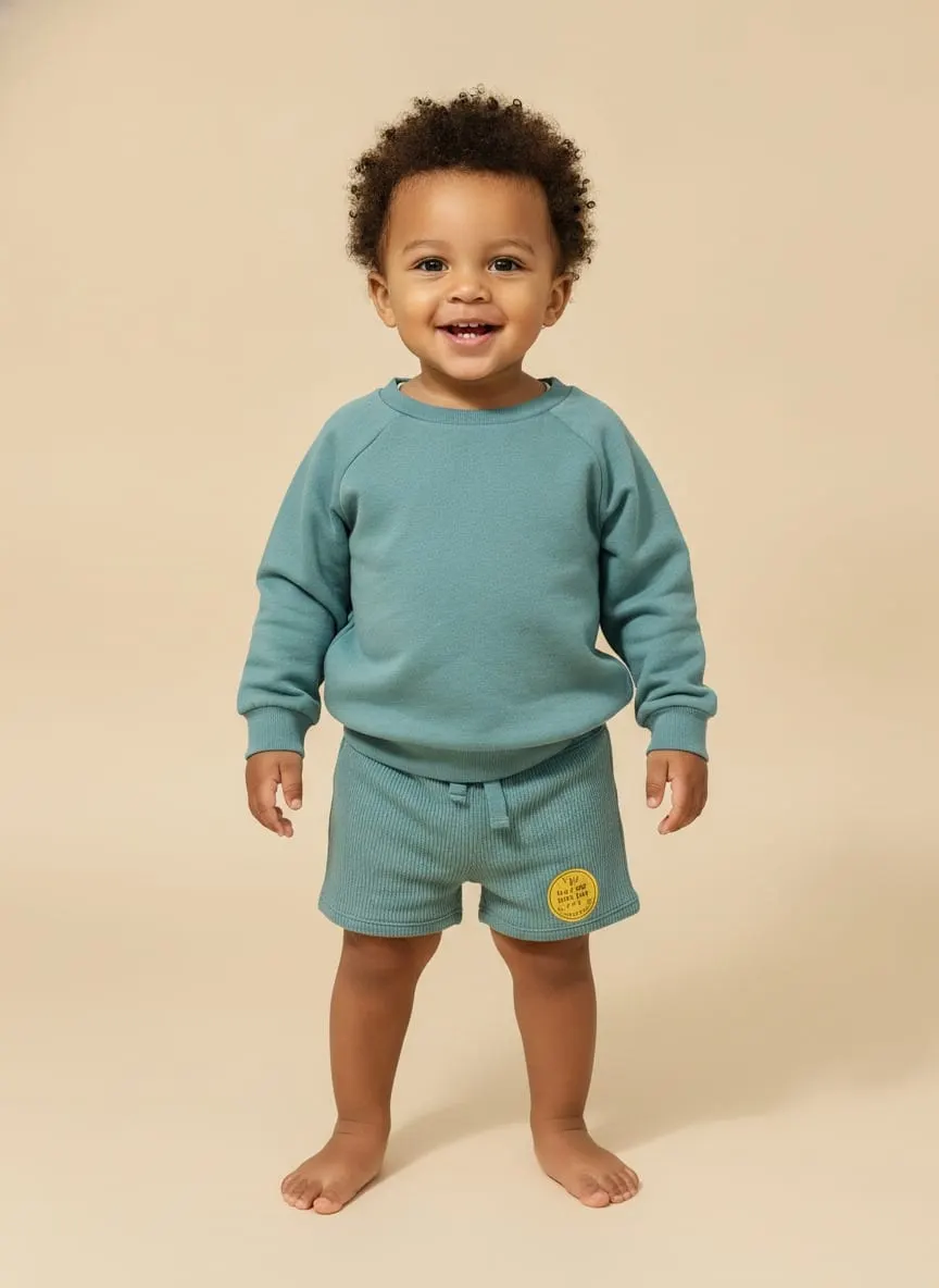 Conjunto color aqua con sudadero y pantaloneta · talla 18 Meses